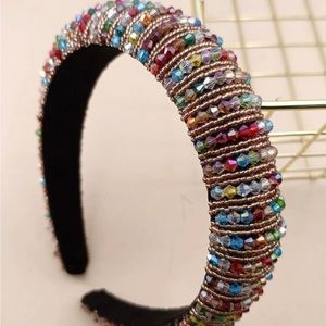 Beautiful bran new black headband with tiny colored jewels.